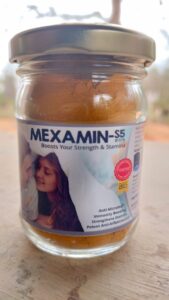 A yellow and white bottle of Mexamin-S5 dietary supplement, made with organic turmeric extract for natural sexual stamina and performance boost