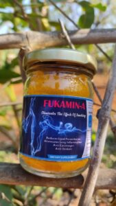 Bottle of Fukamin-A, organic turmeric supplement for respiratory health.